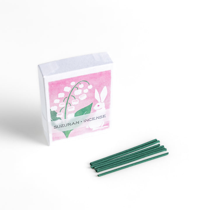 Incense featuring deep green sticks in a box decorated with an elegant lily of the valley and rabbit illustration, offering a delicate and soothing floral fragrance.