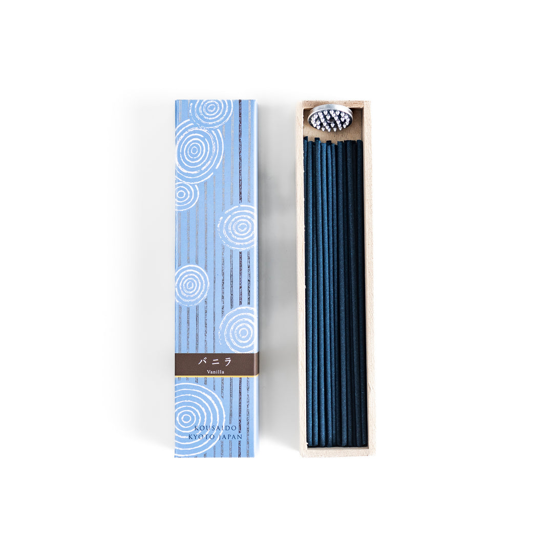 Velvet Vanilla Incense in a light wooden box with deep navy sticks, elegantly packaged in a soft blue design featuring white circular patterns, evoking a warm and comforting vanilla aroma.