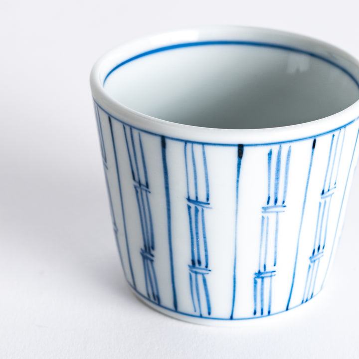 Close-up photo of the blue vertical bamboo line patterned bowl, focusing on the bamboo lines.