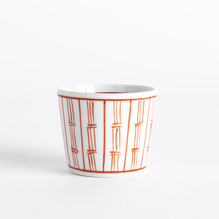 White bowl with red vertical bamboo line pattern, featuring a modern and vibrant design.