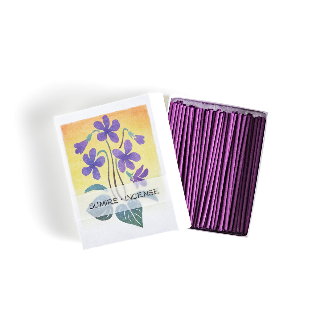 Incense featuring deep violet sticks in a box adorned with a delicate violet flower illustration, offering a floral and soothing fragrance for relaxation.