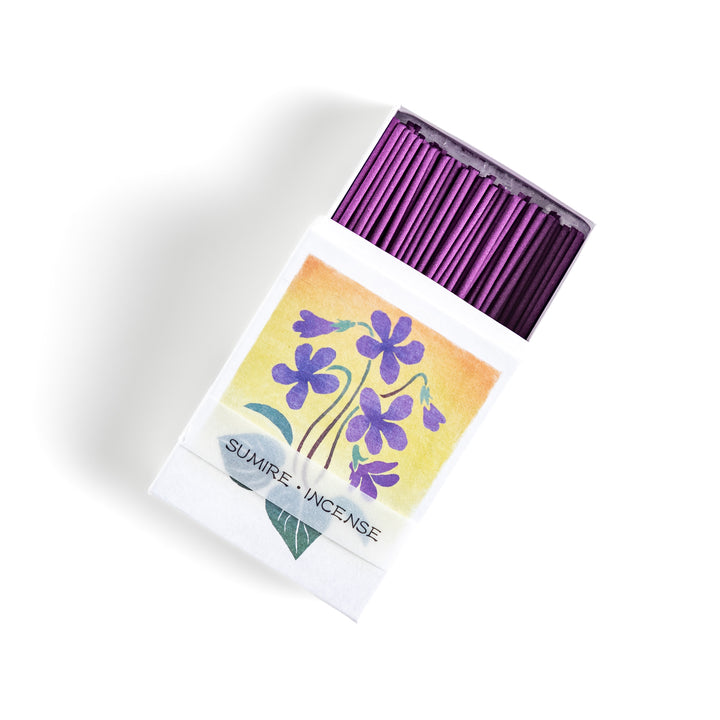 Incense featuring deep violet sticks in a box adorned with a delicate violet flower illustration, offering a floral and soothing fragrance for relaxation.