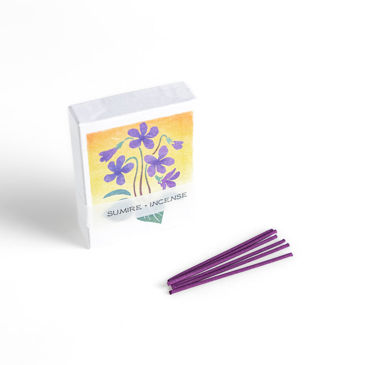 Incense featuring deep violet sticks in a box adorned with a delicate violet flower illustration, offering a floral and soothing fragrance for relaxation.