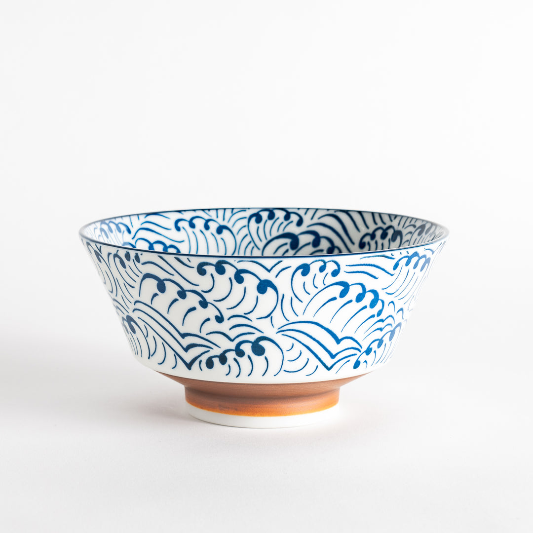 Blue and white ramen bowl with wave pattern.