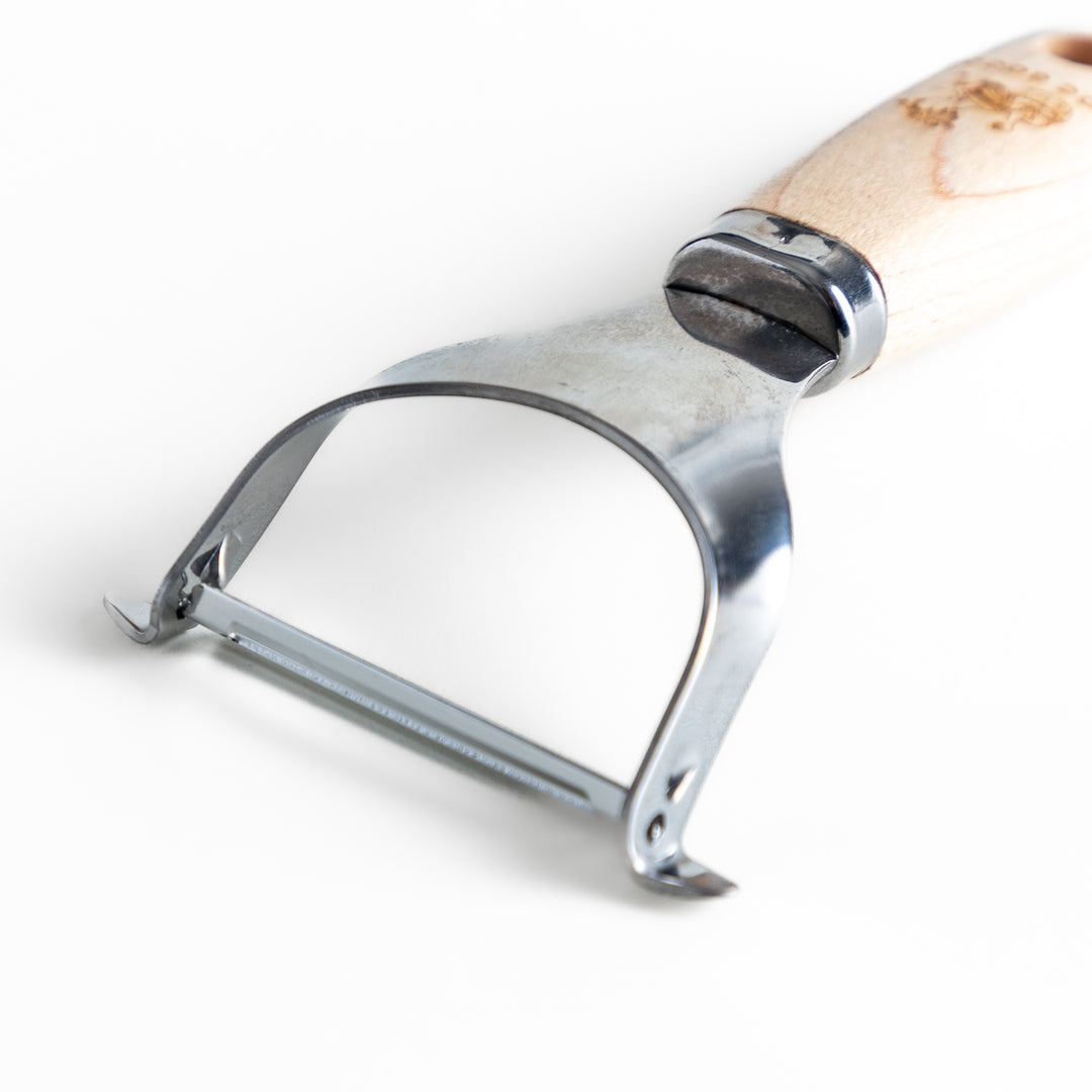 Wooden-handled julienne peeler with sharp stainless steel blade, featuring the JOC Goods logo, perfect kitchenware for vegetable strips.