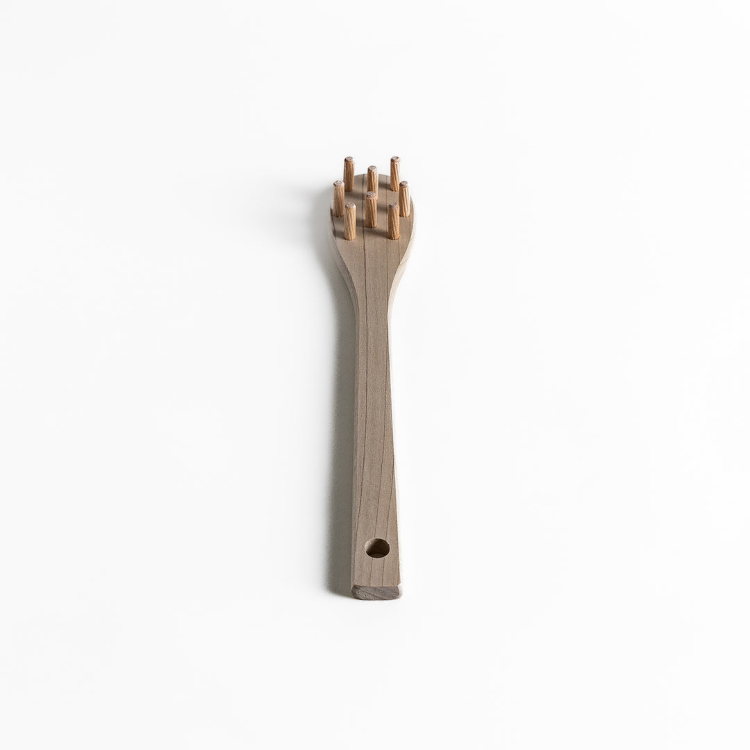 Wood Pasta Fork, a kitchenware tool with a wooden handle and forked design, ideal for stirring and serving pasta with ease while adding a natural touch to your kitchen.