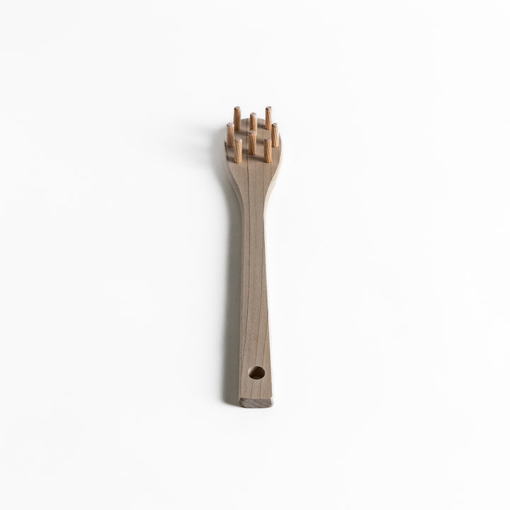 Wood Pasta Fork, a kitchenware tool with a wooden handle and forked design, ideal for stirring and serving pasta with ease while adding a natural touch to your kitchen.