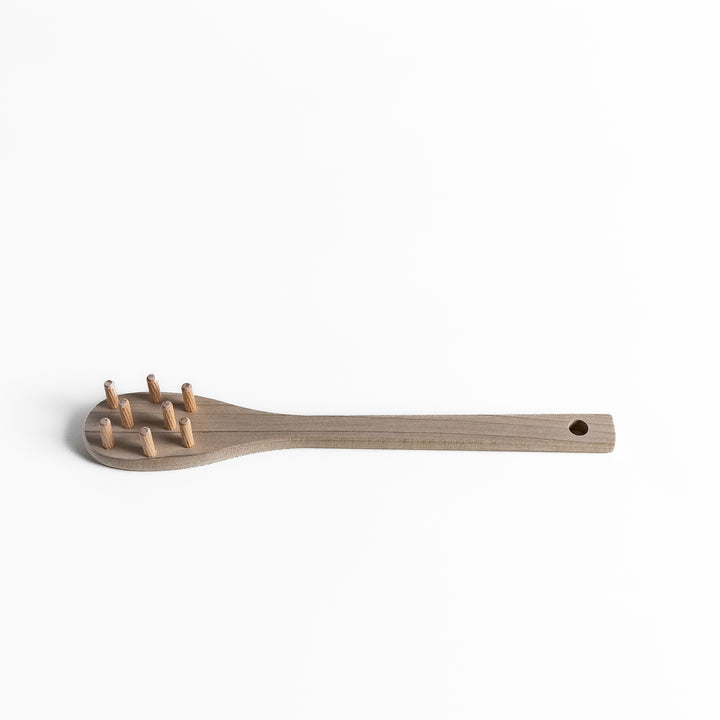 Wood Pasta Fork, a kitchenware tool with a wooden handle and forked design, ideal for stirring and serving pasta with ease while adding a natural touch to your kitchen.