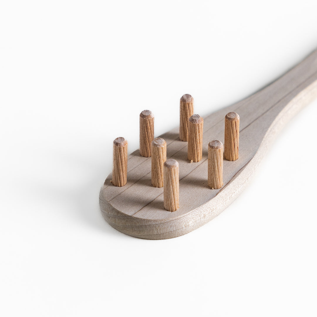 Wood Pasta Fork, a kitchenware tool with a wooden handle and forked design, ideal for stirring and serving pasta with ease while adding a natural touch to your kitchen.