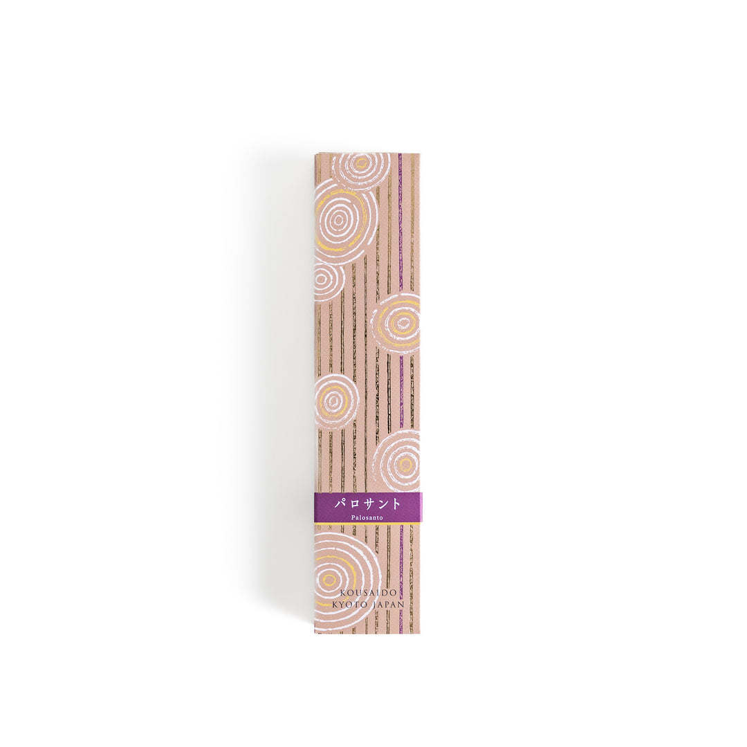 Woodland Palo Santo Incense in a light wooden box with warm brown sticks, elegantly packaged in a soft beige design featuring white circular patterns, evoking a calming and purifying Palo Santo aroma.