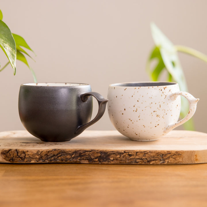 Chic speckled mug in black and white, perfect for enjoying your favorite hot beverages. Stylish design enhances your drinking experience and adds charm to your kitchen.