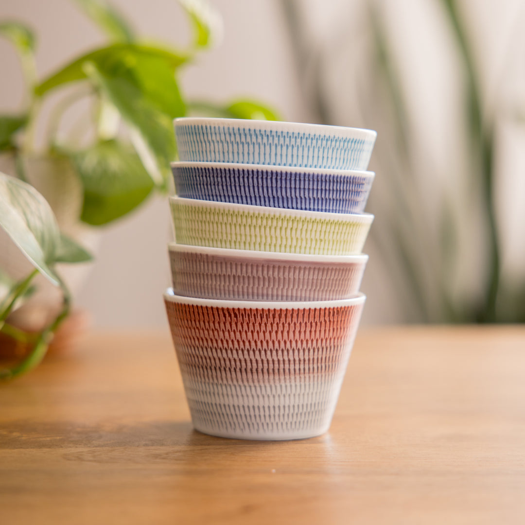 Charming dessert bowl with delicate ethereal stripes, perfect for serving ice cream or fruit, enhancing any dining experience.