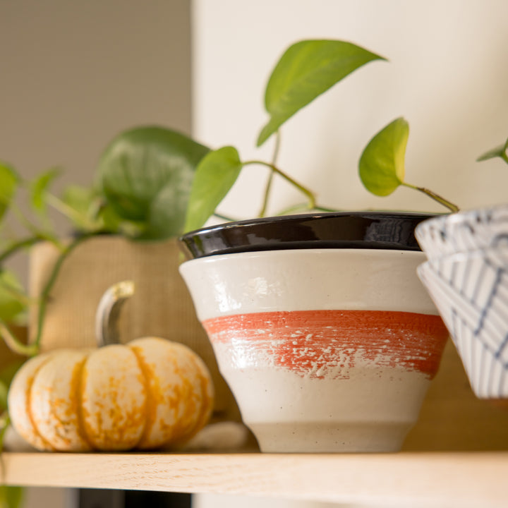 Red Swirl White Ramen Bowl in ceramic features a striking red swirl pattern. Ideal for serving ramen, salads, or pasta dishes.