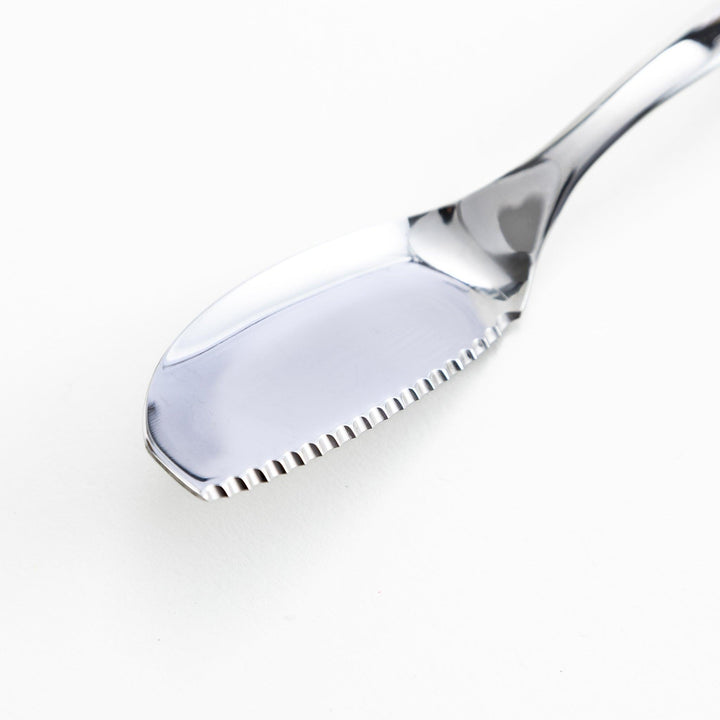 Stainless steel spreader knife with a serrated edge and sleek design