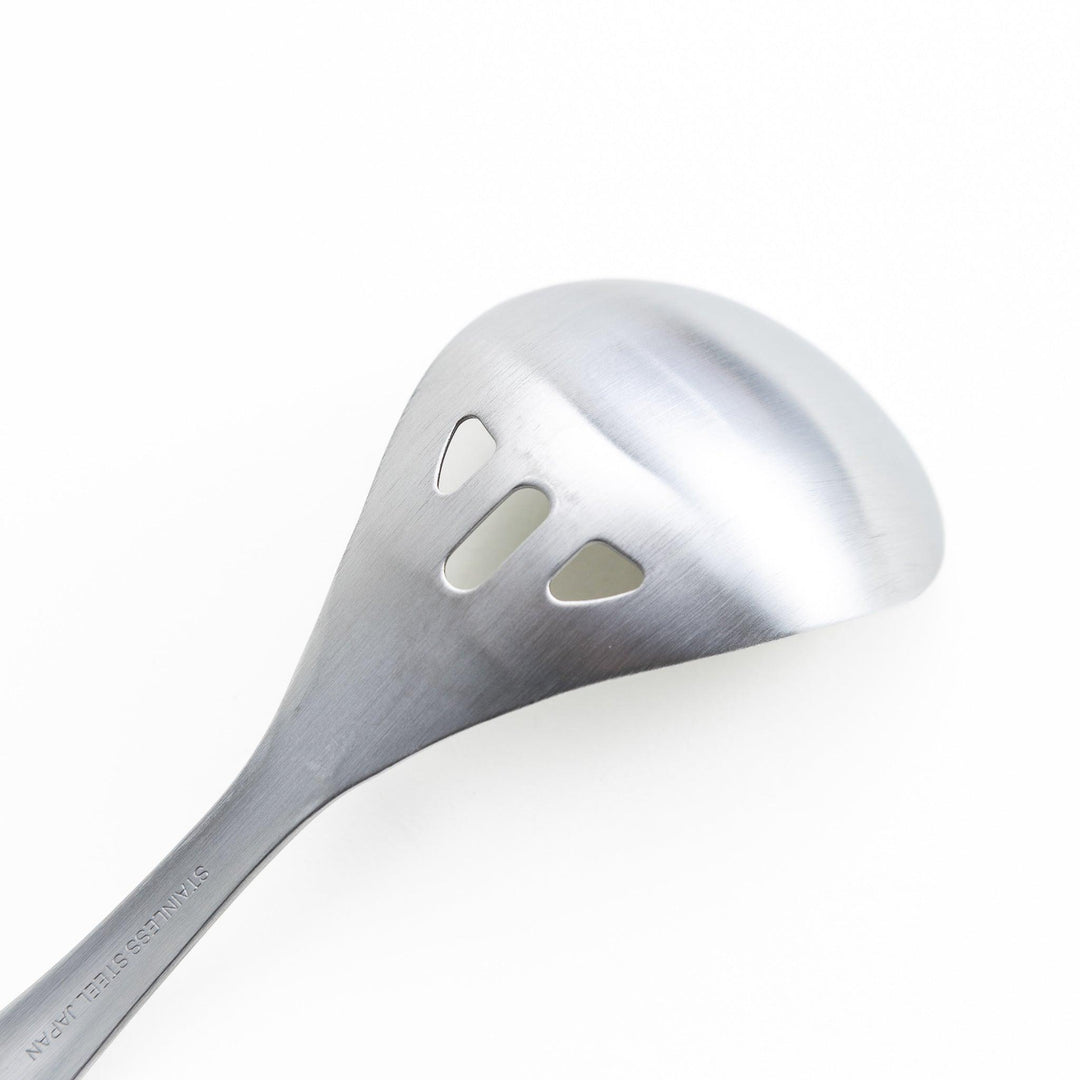 Stainless steel ladle with slotted holes for draining liquids while serving