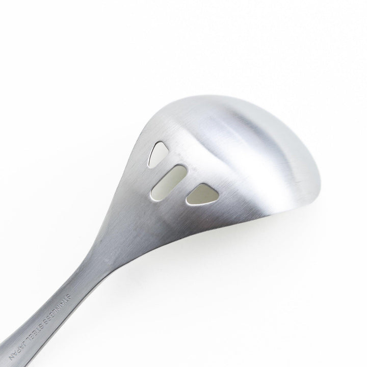 Stainless steel ladle with slotted holes for draining liquids while serving