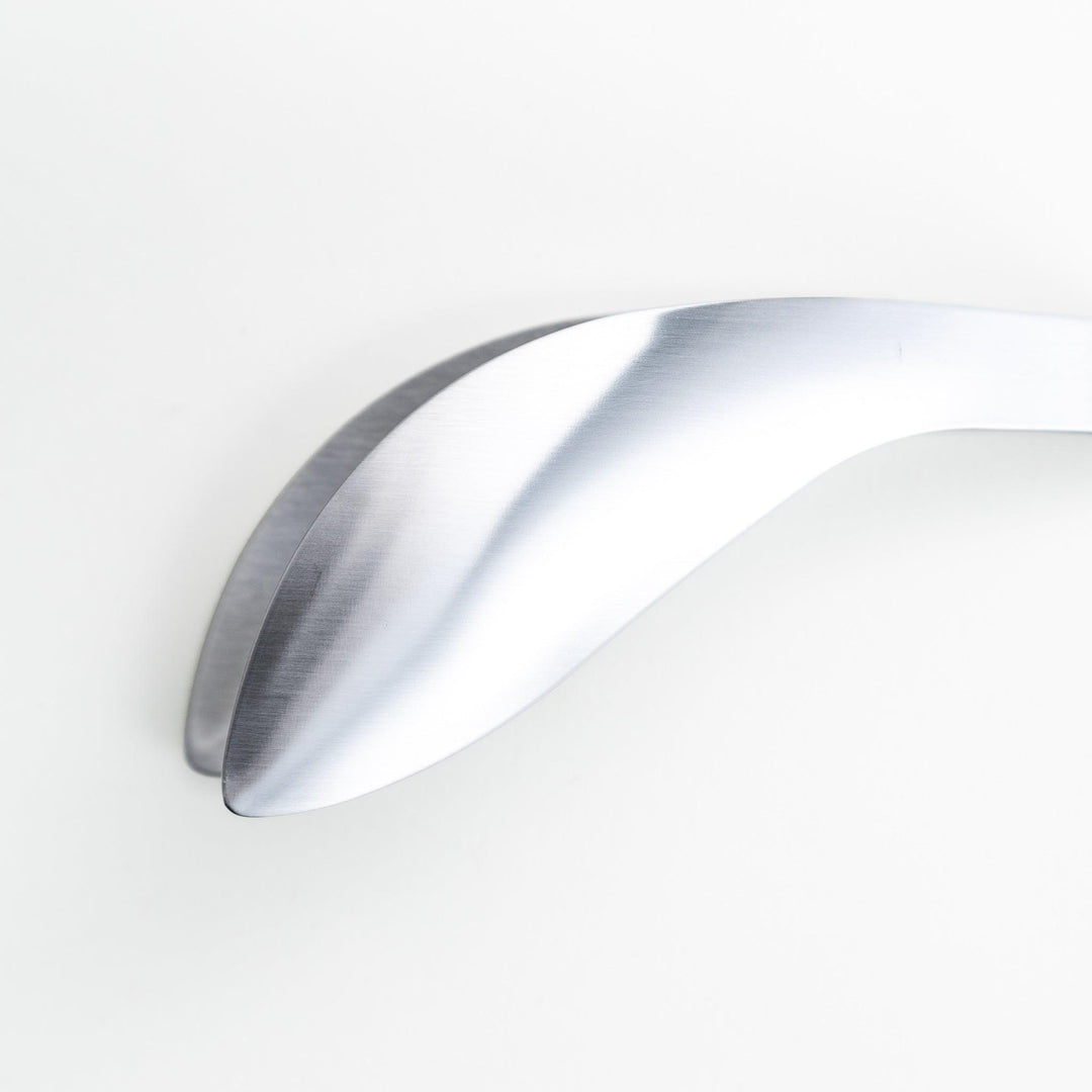 Curved stainless steel tongs that is meant to double as fingers