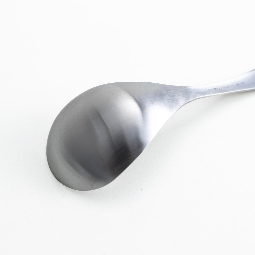 Solid stainless steel ladle with a smooth, curved handle and bowl