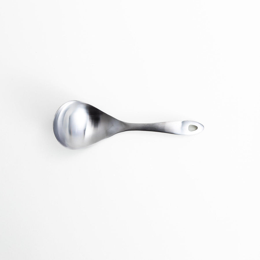 Solid stainless steel ladle with a smooth, curved handle and bowl