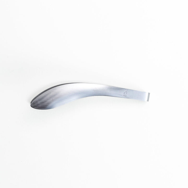 Elegant, curved stainless steel tongs with a sleek design