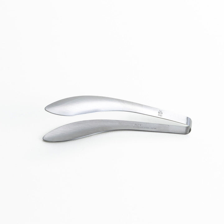 Elegant, curved stainless steel tongs with a sleek design