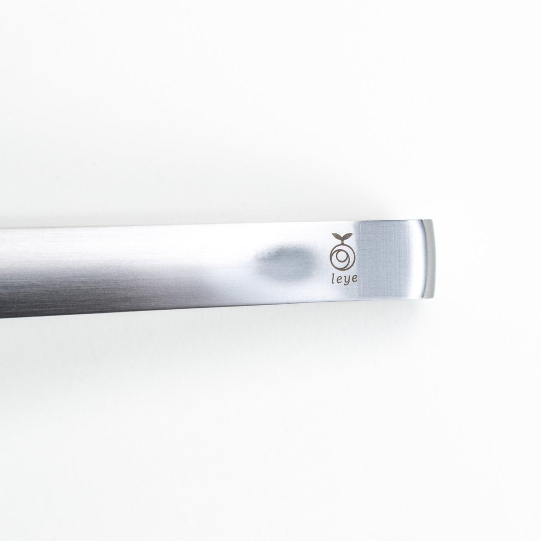 Smooth, curved stainless steel tongs with a minimalist design.