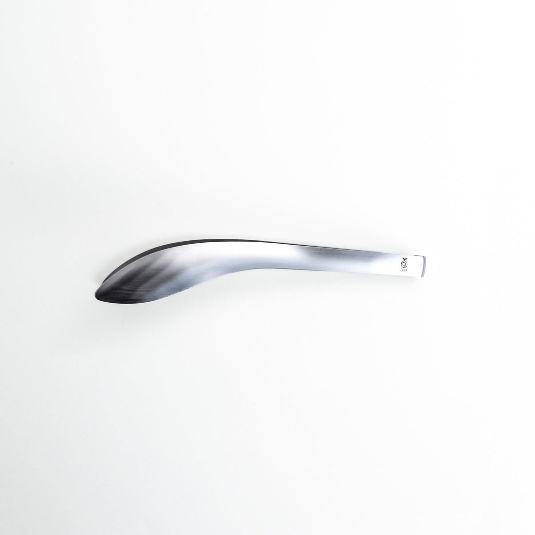 Smooth, curved stainless steel tongs with a minimalist design.