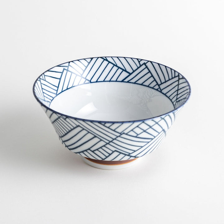 Basket weave patterned bowl with intricate blue geometric lines on a white background, featuring a brown base.