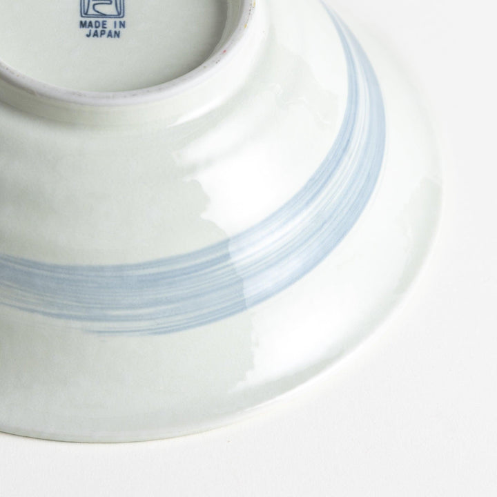 A large white bowl with a blue swirl pattern on the interior, featuring a smooth finish.