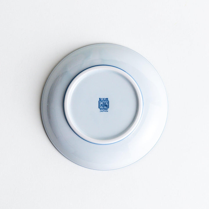 A dessert plate featuring a blue sakura (cherry blossom) pattern across its surface.