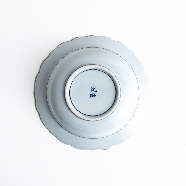 A ceramic bowl with a blue floral pattern around the rim.