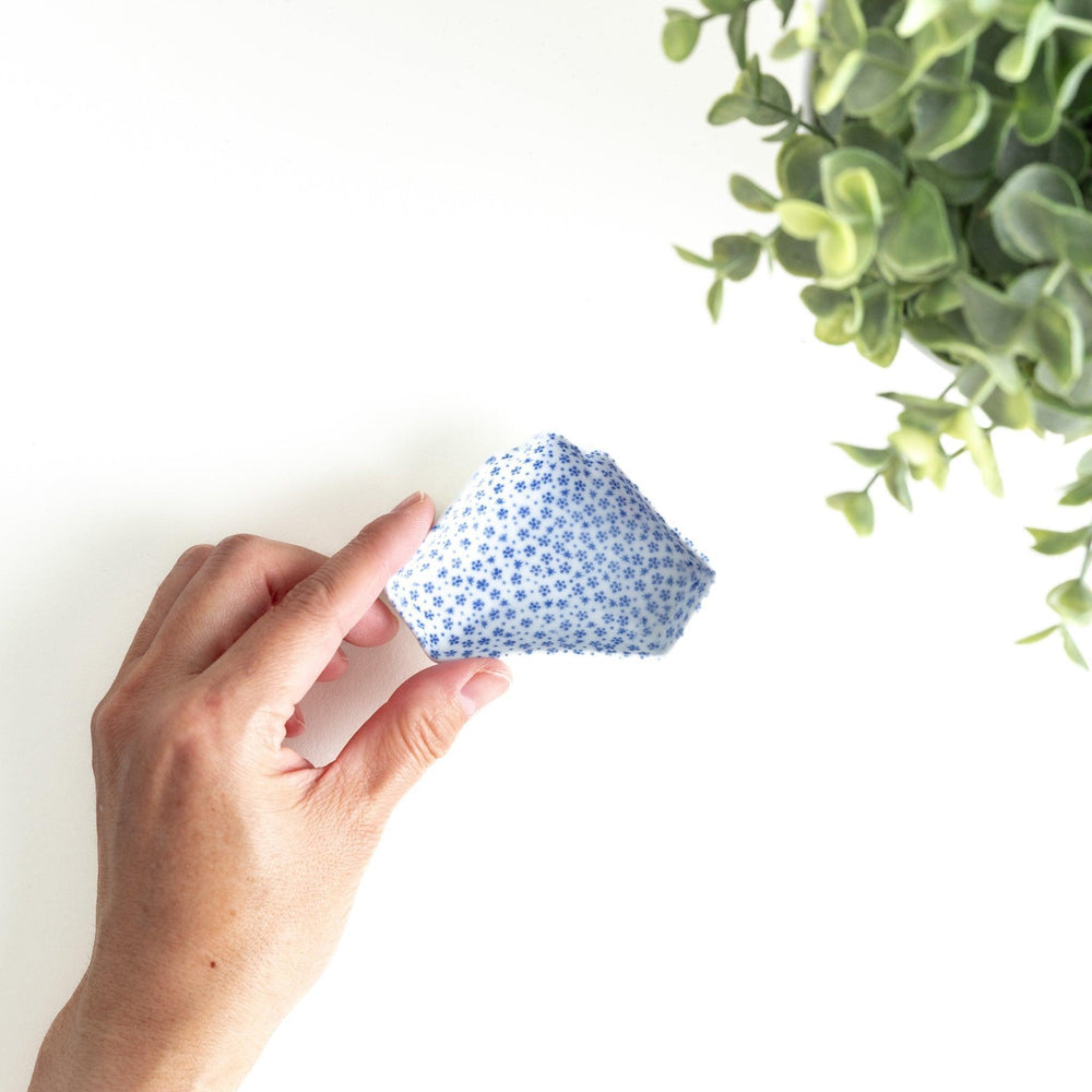 Mt. Fuji-shaped plate with a small blue dotted pattern.