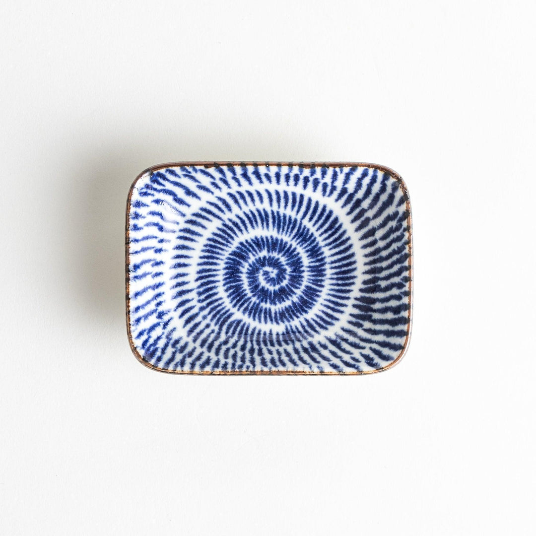 A small rectangular dish featuring a traditional Japanese design with a blue spiral pattern on a white background.