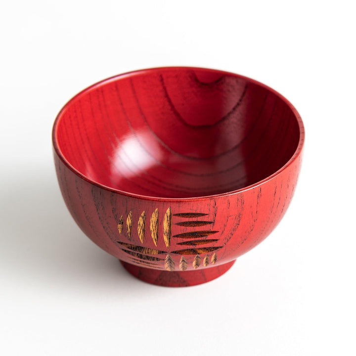 A traditional lacquered wooden bowl featuring a hand-carved pattern of lines and geometric shapes. Available in black or red.