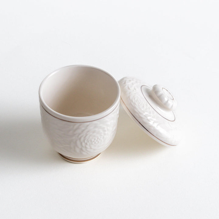 White ceramic chawanmushi bowl with gold trim.