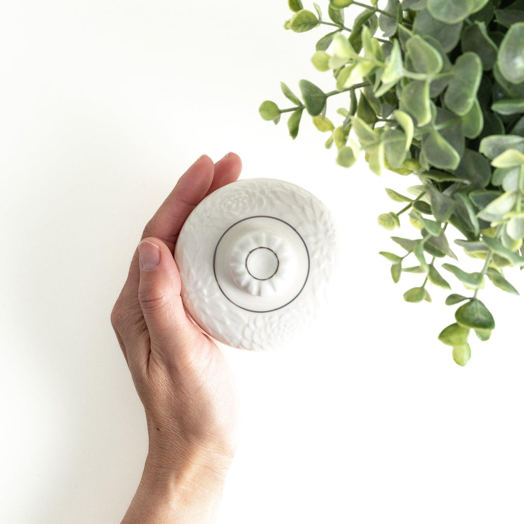 White ceramic chawanmushi bowl with gold trim.