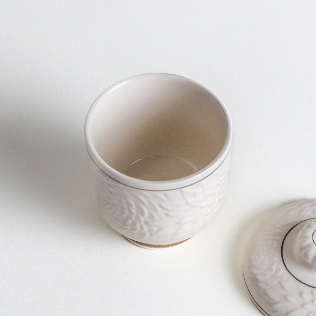 White ceramic chawanmushi bowl with gold trim.