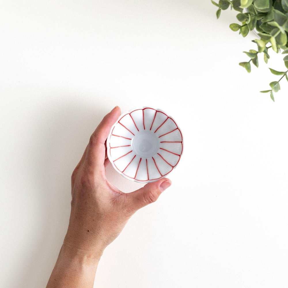 Small scalloped edge condiment bowls, one with blue stripes and the other with red stripes