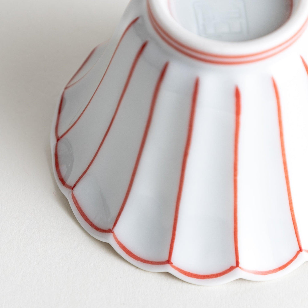 Small scalloped edge condiment bowls, one with blue stripes and the other with red stripes