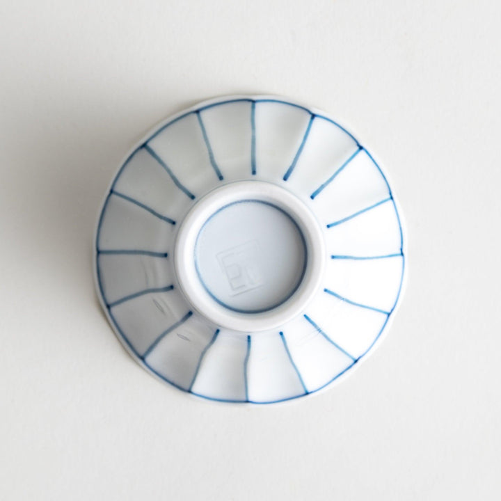 Small scalloped edge condiment bowls, one with blue stripes and the other with red stripes