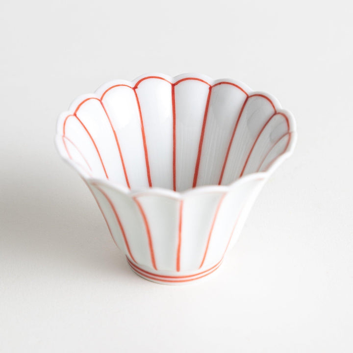 Small scalloped edge condiment bowls, one with blue stripes and the other with red stripes