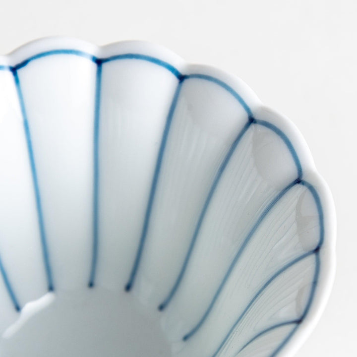 Small scalloped edge condiment bowls, one with blue stripes and the other with red stripes