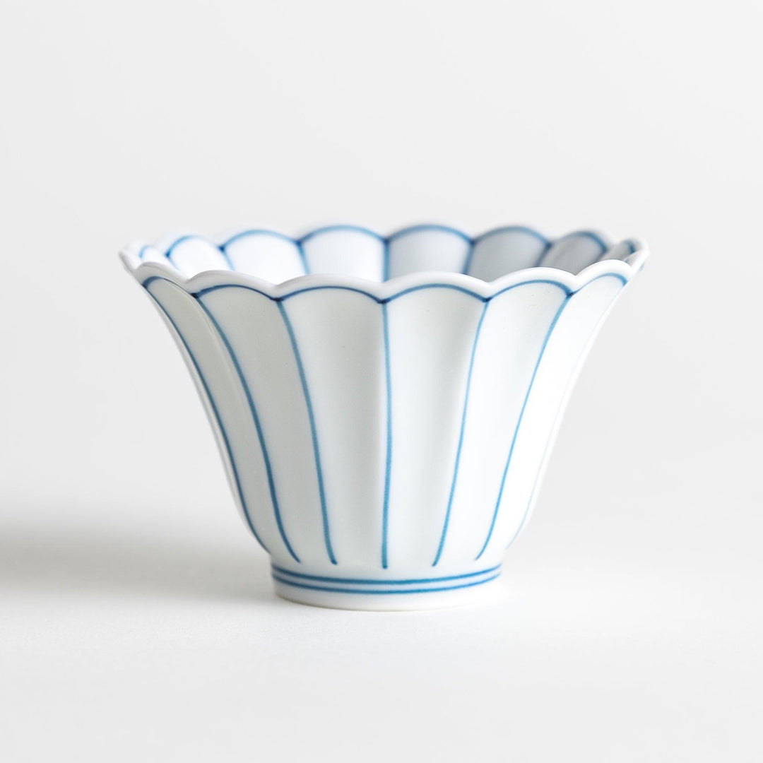 Small scalloped edge condiment bowls, one with blue stripes and the other with red stripes