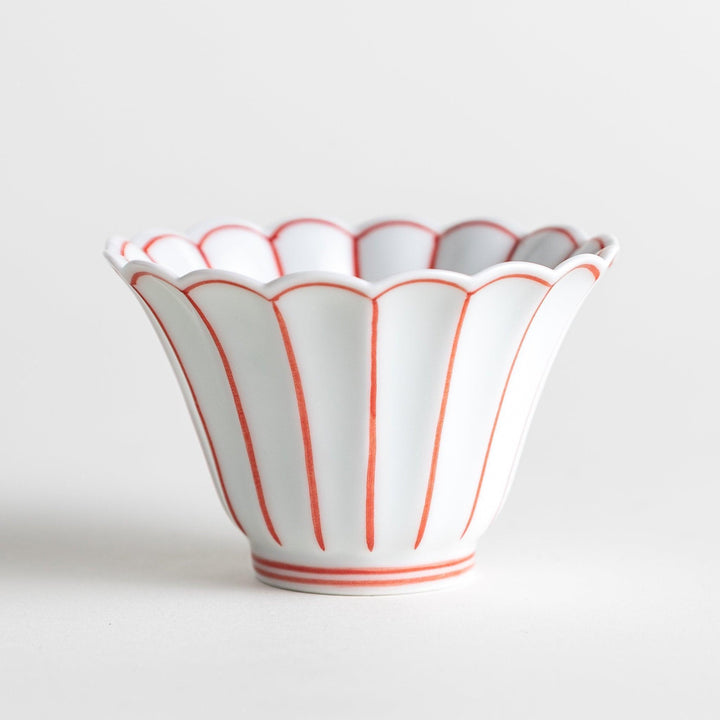 Small scalloped edge condiment bowls, one with blue stripes and the other with red stripes