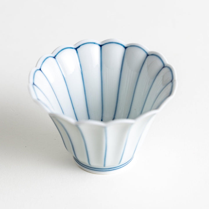 Small scalloped edge condiment bowls, one with blue stripes and the other with red stripes