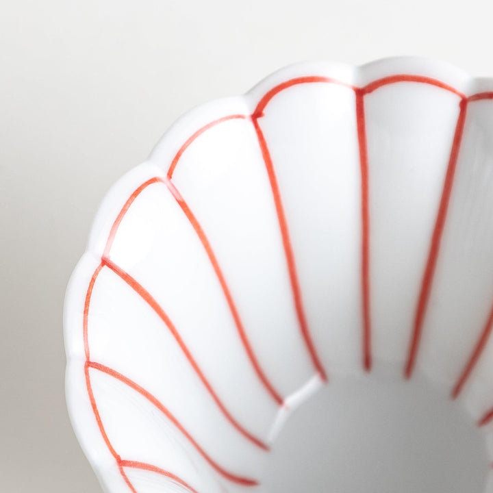 Small scalloped edge condiment bowls, one with blue stripes and the other with red stripes