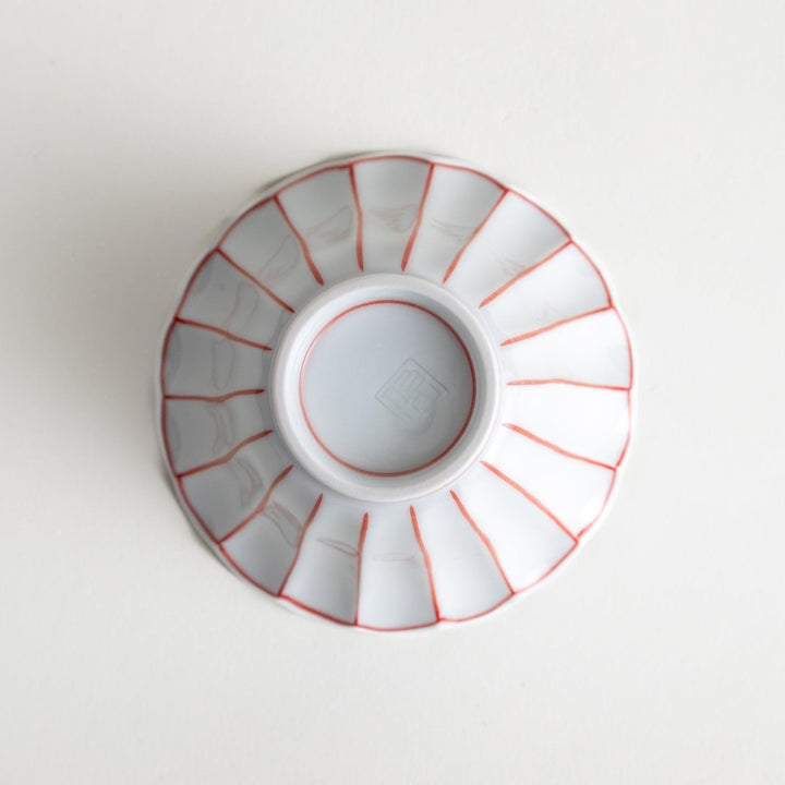 Scalloped edge condiment bowls, one with blue stripes and the other with red stripes