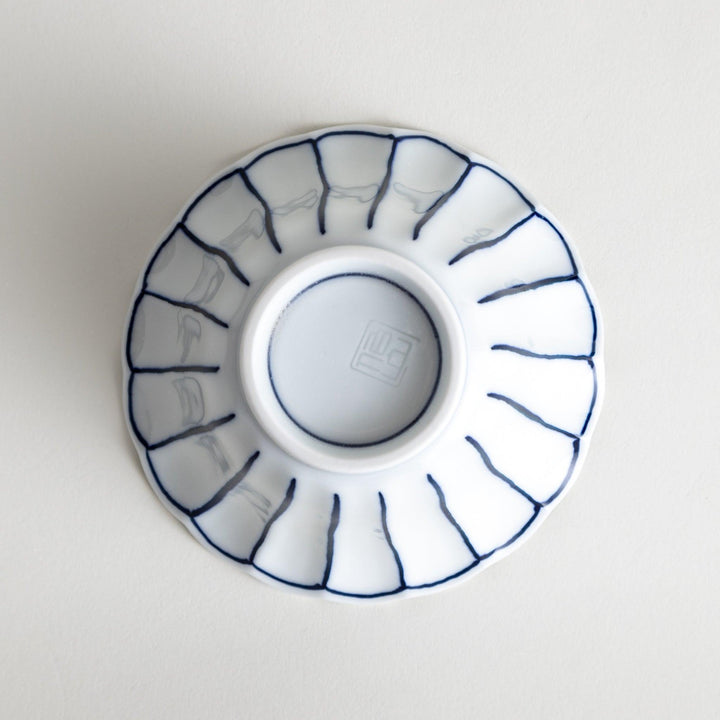 Scalloped edge condiment bowls, one with blue stripes and the other with red stripes