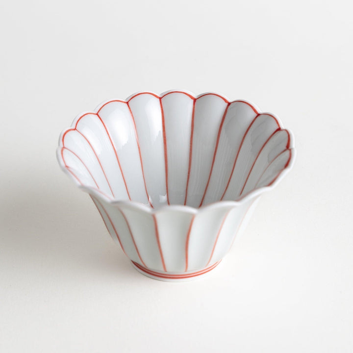 Scalloped edge condiment bowls, one with blue stripes and the other with red stripes