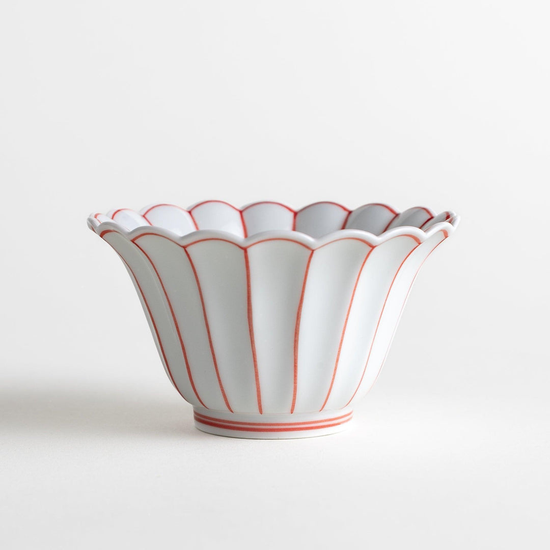 Scalloped edge condiment bowls, one with blue stripes and the other with red stripes